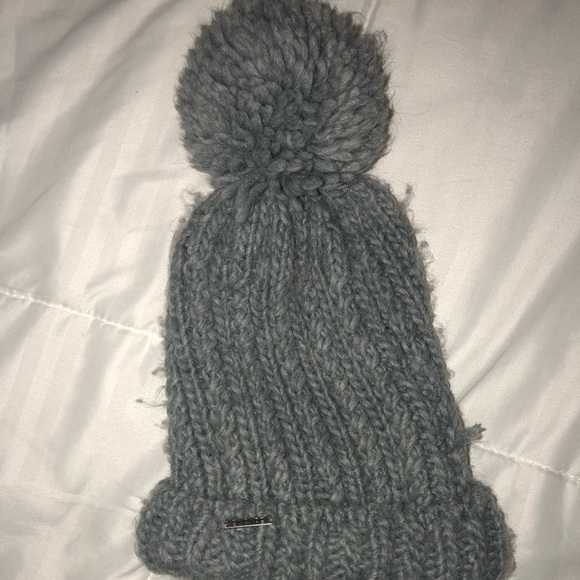 knit cap with ball on top